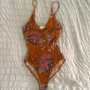 Orange patterned bodysuit